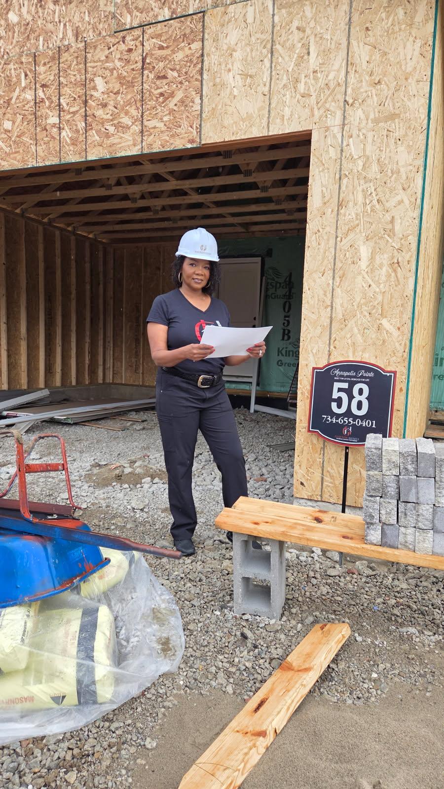 ShaWanna Gajewski reviewing plans on-site at an Annapolis Pointe home under construction
