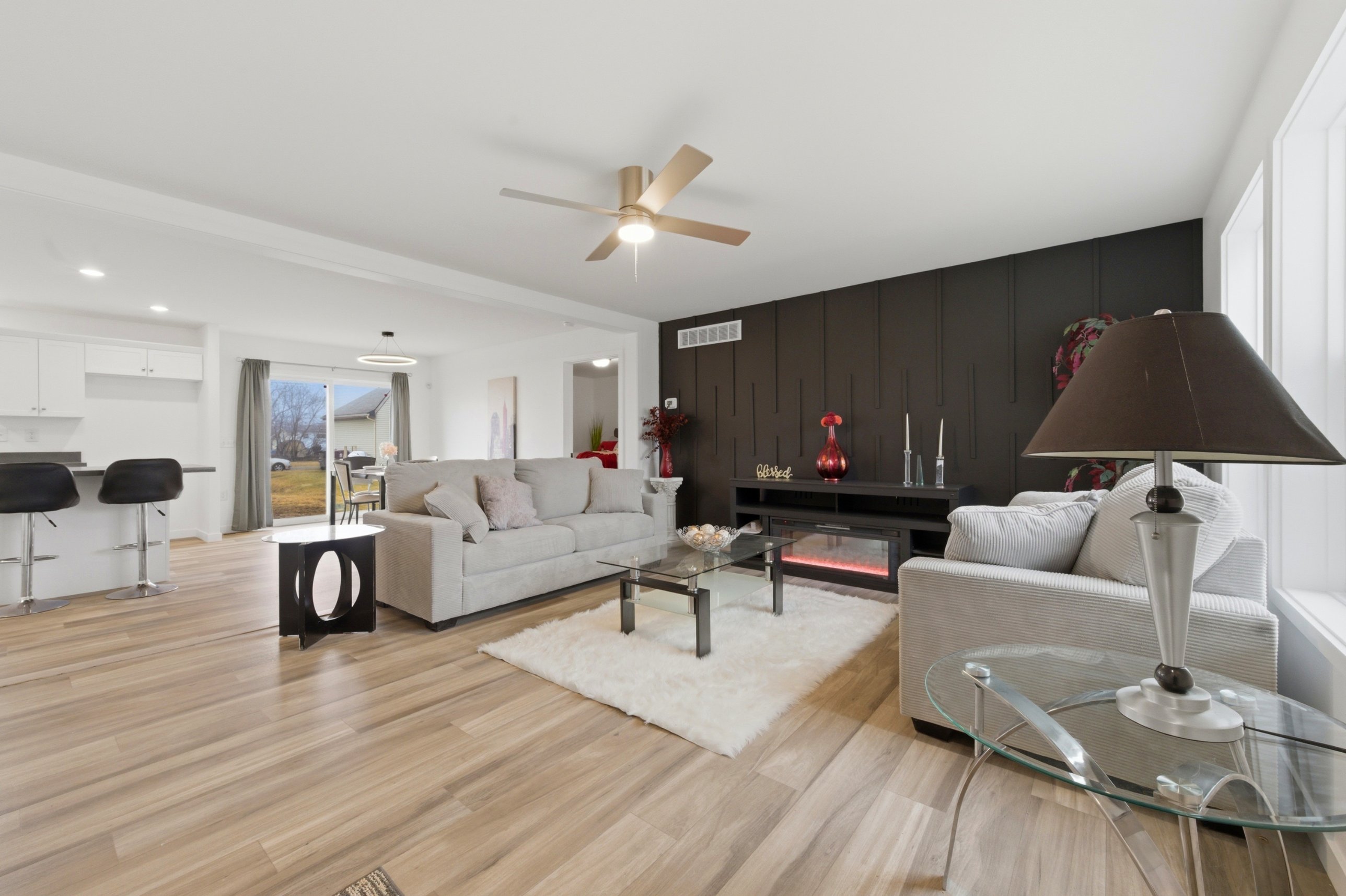 Living room with accent wall and electric fireplace